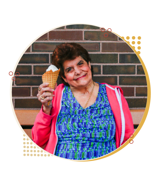 woman holding ice cream and smiling