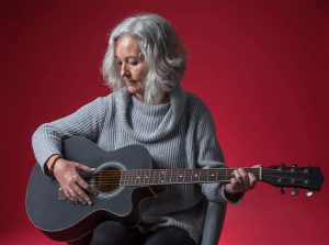 Woman playing guitar
