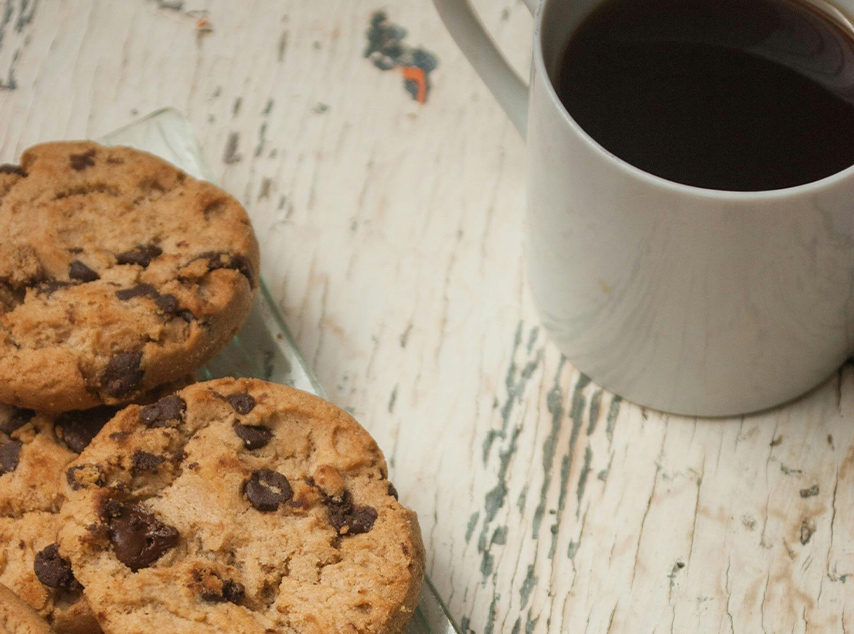 coffee cup and chocolate chip cookies
